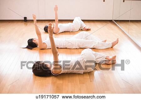 Young women exercising View Large Photo Image Stock Photo - Young women exercising. Fotosearch