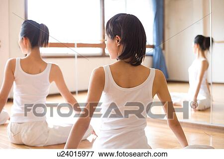 Young women exercising View Large Photo Image Stock Photo - Young women exercising. Fotosearch