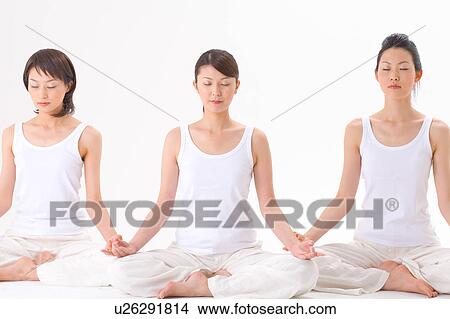 Young women meditating View Large Photo Image Picture - Young women meditating. Fotosearch