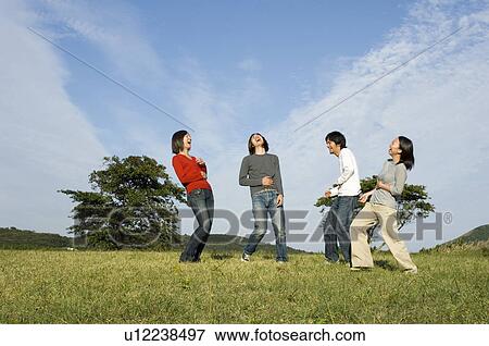 Four young people laughing View Large Photo Image Stock Photo - Four young people laughing. Fotosearch
