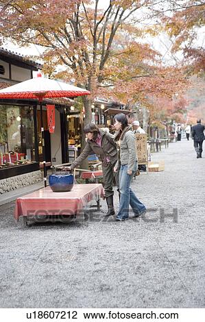 Two young women browsing at souvenir shop, Ohara Sanzenin Temple, Kyoto Prefecture, Japan View Large Photo Image Stock Image - Two young women browsing at souvenir shop, Ohara Sanzenin Temple, Kyoto Prefecture, Japan. Fotosearch