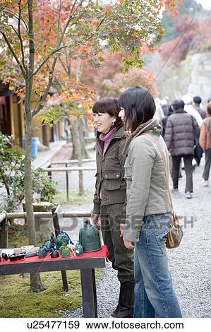 Two young women browsing at souvenir shop, Ohara Sanzenin Temple, Kyoto Prefecture, Japan View Large Photo Image Stock Photo - Two young women browsing at souvenir shop, Ohara Sanzenin Temple, Kyoto Prefecture, Japan. Fotosearch