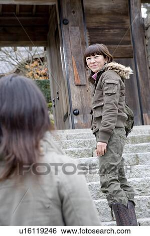 Two young women standing on steps at Ohara Sanzenin Temple, Kyoto Prefecture, Japan View Large Photo Image Stock Photograph - Two young women standing on steps at Ohara Sanzenin Temple, Kyoto Prefecture, Japan. Fotosearch