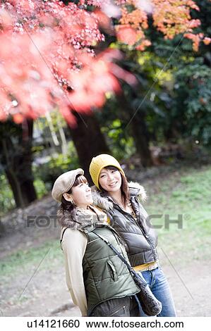 Two young women walking, Kamigamo Shrine, Kyoto Prefecture, Japan View Large Photo Image Stock Image - Two young women walking, Kamigamo Shrine, Kyoto Prefecture, Japan. Fotosearch