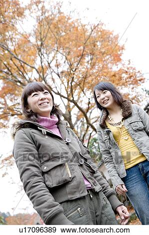 Stock Photo - Two young women walking, Ohara Sanzenin Temple, Kyoto Prefecture, Japan. Fotosearch