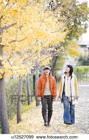 Stock Photo - Two young women walking. Fotosearch