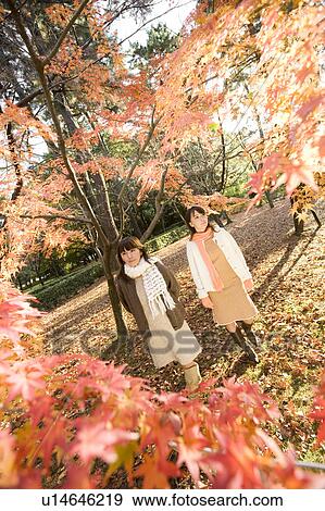 Stock Photo - Two young women walking. Fotosearch