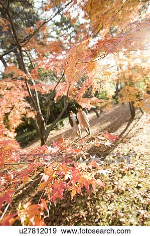 Stock Photo - Two young women walking. Fotosearch