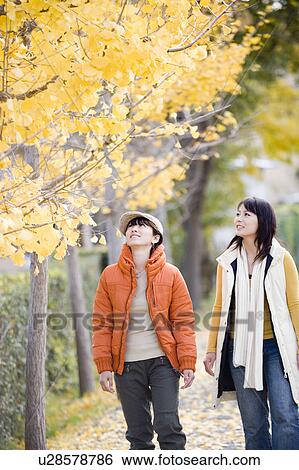 Stock Photograph - Two young women walking. Fotosearch