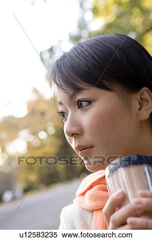 Young woman drinking coffee View Large Photo Image Stock Photography - Young woman drinking coffee. Fotosearch