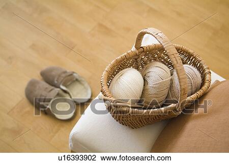 Basket of wool on chair View Large Photo Image Stock Image - Basket of wool on chair. Fotosearch