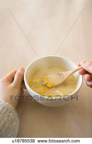 Cup of corn soup View Large Photo Image Stock Photo - Cup of corn soup. Fotosearch
