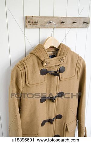 Duffel coat hanging on wall View Large Photo Image Stock Image - Duffel coat hanging on wall. Fotosearch