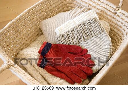 Stock Photo - Knit garments in basket. Fotosearch