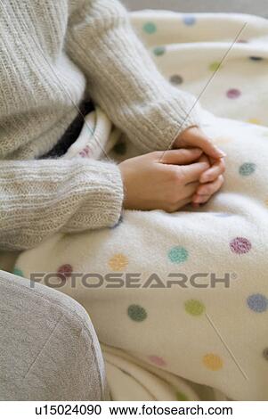 Woman sitting with blanket on View Large Photo Image Stock Image - Woman sitting with blanket on. Fotosearch