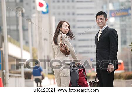 Business couple pushing baby stroller View Large Photo Image Stock Image - Business couple pushing baby stroller. Fotosearch