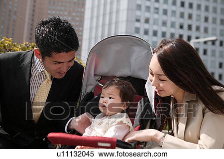 Business couple with baby View Large Photo Image Stock Photography - Business couple with baby. Fotosearch