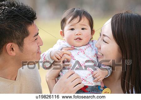 Family with baby View Large Photo Image Stock Photograph - Family with baby. Fotosearch