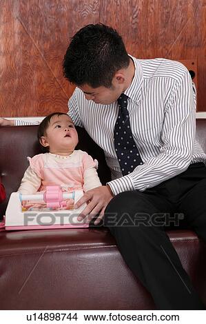 Father playing with baby View Large Photo Image Picture - Father playing with baby. Fotosearch