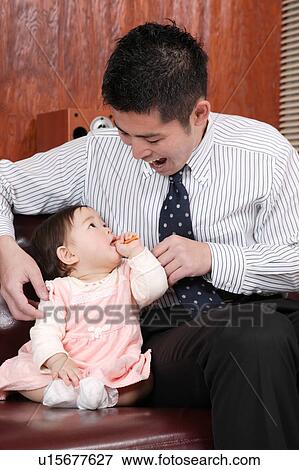 Father playing with baby View Large Photo Image Stock Photo - Father playing with baby. Fotosearch