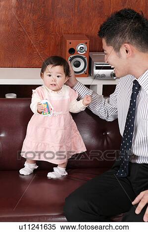 Father playing with baby View Large Photo Image Stock Photography - Father playing with baby. Fotosearch