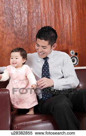 Father playing with baby View Large Photo Image Stock Photography - Father playing with baby. Fotosearch