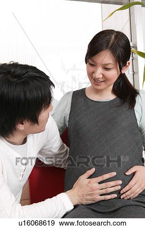 Pregnant couple View Large Photo Image Stock Photo - Pregnant couple. Fotosearch