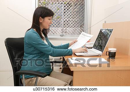 Pregnant woman at work View Large Photo Image Stock Photograph - Pregnant woman at work. Fotosearch