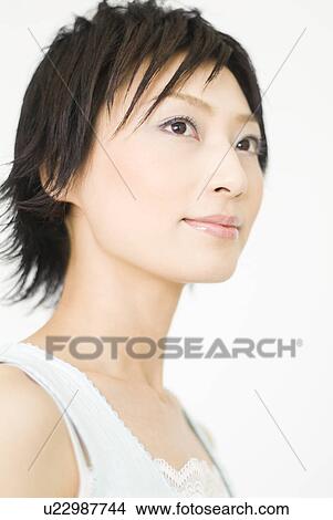 Young woman looking away View Large Photo Image Picture - Young woman looking away. Fotosearch
