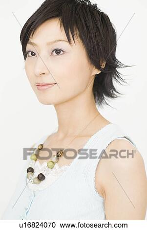 Stock Image - Young woman looking away. Fotosearch