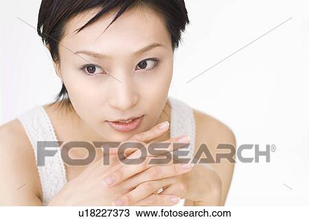 Young woman looking away View Large Photo Image Stock Image - Young woman looking away. Fotosearch