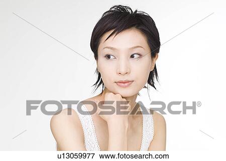 Young woman looking away View Large Photo Image Stock Photo - Young woman looking away. Fotosearch