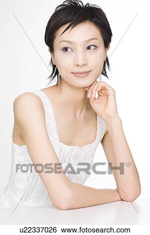 Young woman looking away View Large Photo Image Stock Photograph - Young woman looking away. Fotosearch