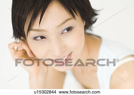 Young woman smiling View Large Photo Image Picture - Young woman smiling. Fotosearch