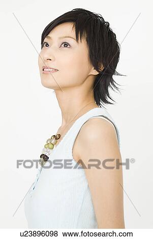 Young woman smiling View Large Photo Image Stock Photo - Young woman smiling. Fotosearch