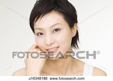 Young woman smiling View Large Photo Image Stock Photograph - Young woman smiling. Fotosearch