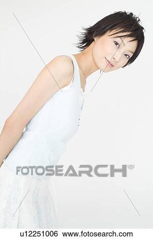 Young woman standing View Large Photo Image Stock Photograph - Young woman standing. Fotosearch