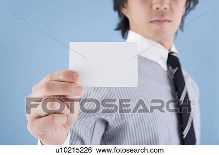 Stock Photograph - Businessman holding memo. Fotosearch