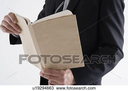 Businessman reading book View Large Photo Image Stock Image - Businessman reading book. Fotosearch