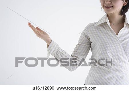 Stock Image - Businesswoman gesturing. Fotosearch