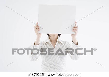 Businesswoman holding blank placard View Large Photo Image Stock Image - Businesswoman holding blank placard. Fotosearch