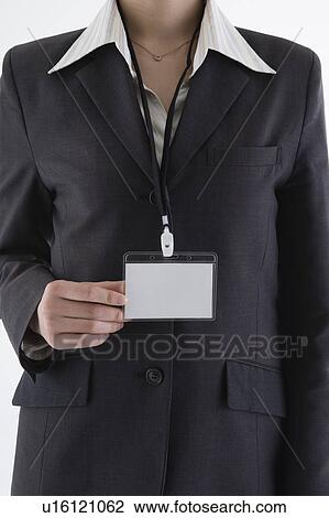 Businesswoman wearing ID card View Large Photo Image Stock Image - Businesswoman wearing ID card. Fotosearch