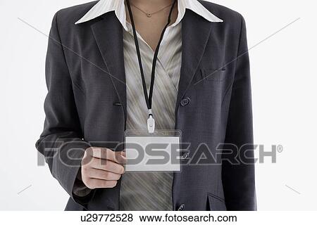 Stock Photo - Businesswoman wearing ID card. Fotosearch