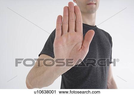 Stock Image - Man showing stop gesture. Fotosearch