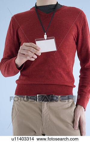 Man wearing ID card View Large Photo Image Picture - Man wearing ID card. Fotosearch