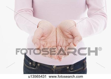 Stock Image - Woman cupping hands. Fotosearch