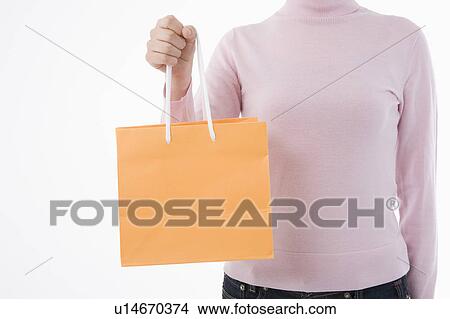 Woman holding paper bag View Large Photo Image Picture - Woman holding paper bag. Fotosearch