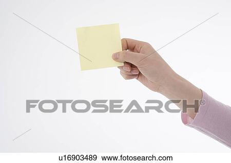 Woman's hand holding memo View Large Photo Image Stock Photo - Woman's hand holding memo. Fotosearch