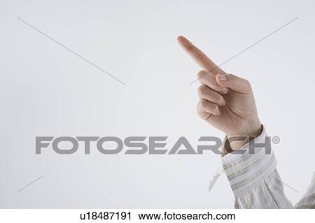 Woman's hand holding up one finger View Large Photo Image Stock Image - Woman's hand holding up one finger . Fotosearch
