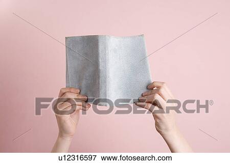 Woman's hands holding book View Large Photo Image Stock Photo - Woman's hands holding book. Fotosearch